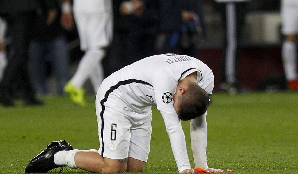 Paris Saint-Germain's Italian midfielder Marco Verratti reacts in agony after Barcelona came all the way back in beating his team 6-1 during the UEFA Champions League second leg round of 16 match. Photo: EPA Paris Saint-Germain's Italian midfielder Marco Verratti reacts in agony after Barcelona came all the way back in beating his team 6-1 during the UEFA Champions League second leg round of 16 match. Photo: EPA