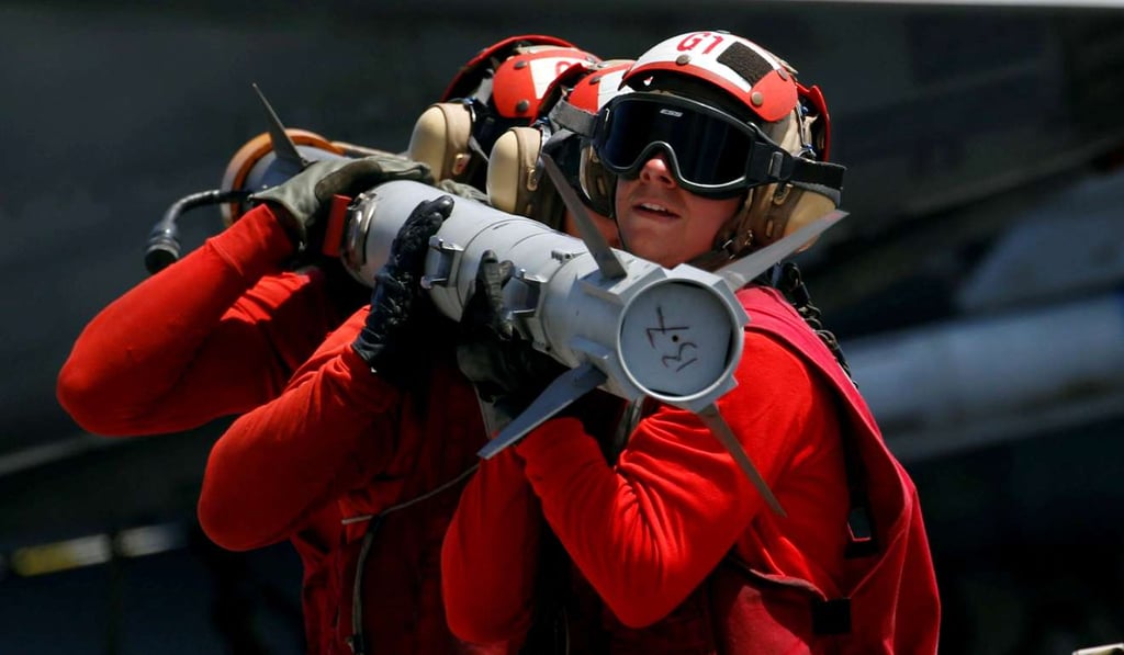 US Navy personnel carry a missile on the aircraft carrier USS Carl Vinson during a routine exercise last week in the South China Sea. The likelihood of more “accidents” involving the Chinese and US warships and planes in the South China Sea cannot be ruled out. Photo: Reuters