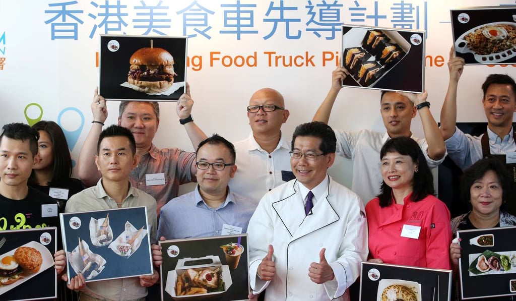Commerce chief Greg So Kam-leung last year with the 16 winners and their signature dishes. Photo: Nora Tam