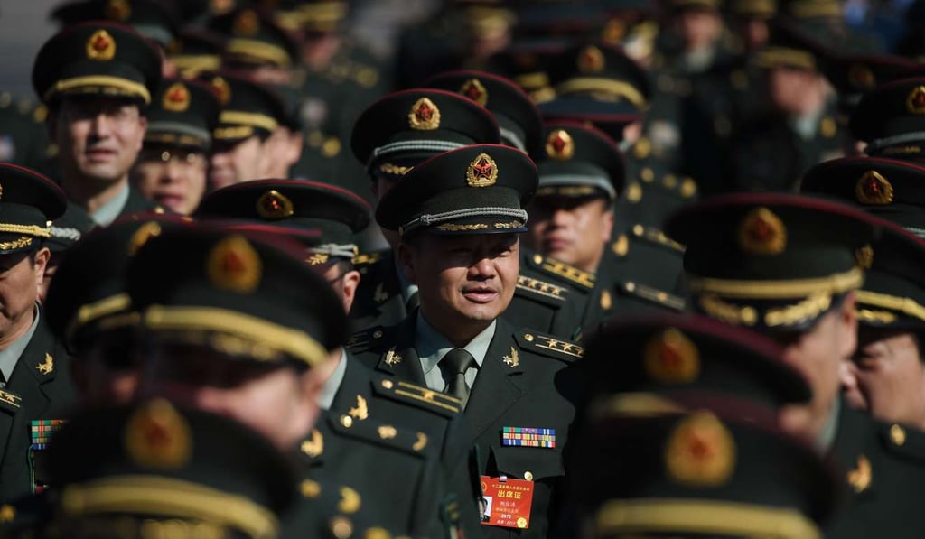 Military delegates arrive at the National People's Congress in the Great Hall of the People in Beijing. Photo: AFP Military delegates arrive at the National People's Congress in the Great Hall of the People in Beijing. Photo: AFP