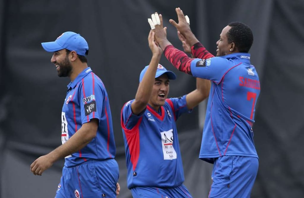 Kowloon Cantons captain Babar Hayat and teammates celebrate against Gladiators. Photo: Felix Wong