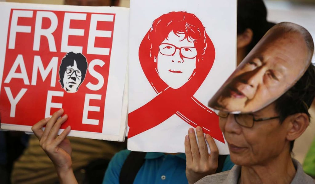 Members of the League of Social Democrats and Left 21 hold placards showing supporting Singaporean Amos Yee during a protest outside the Singapore Consulate at Admiralty Centre in Hong Kong in 2015. Photo: Nora Tam