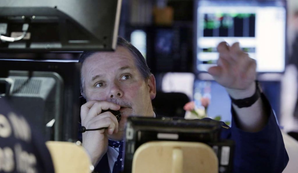 Trader Michael Conlon works on the floor of the New York Stock Exchange as global equities rose and looked toward next week’s likely increase in US interest rates by the Federal Reserve. Photo: AP