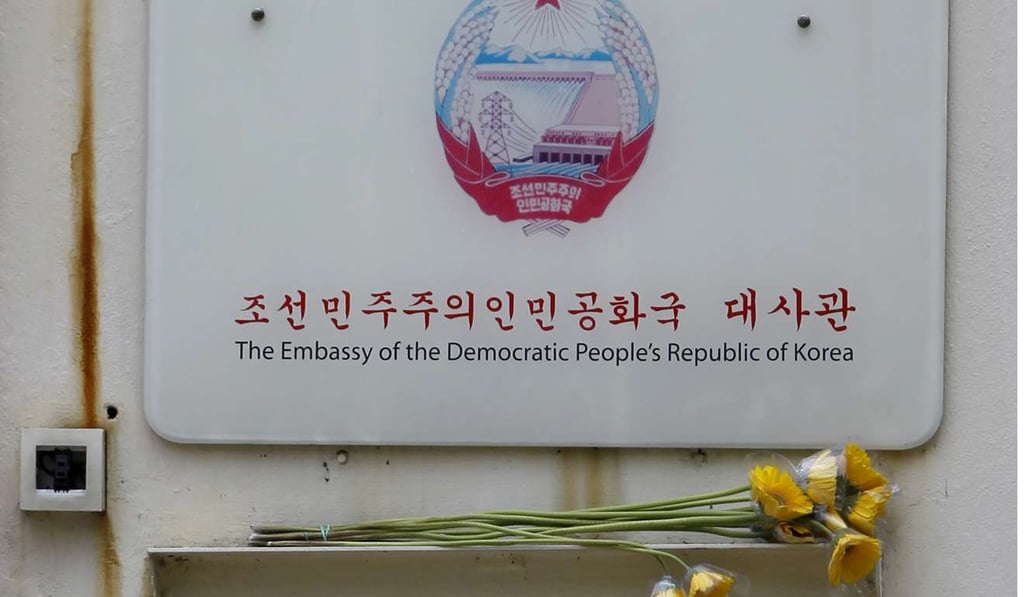 Flowers are left at the main gate of the North Korean Embassy in Kuala Lumpur. Photo: AP