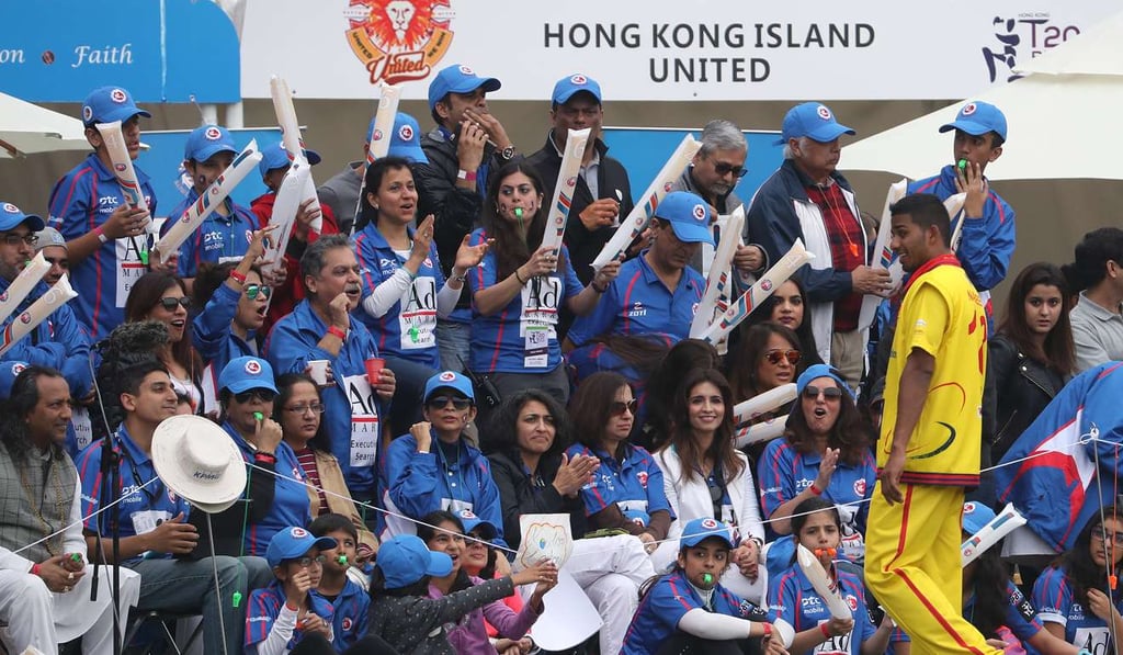 Kowloon Cantons fans cheer on their team.