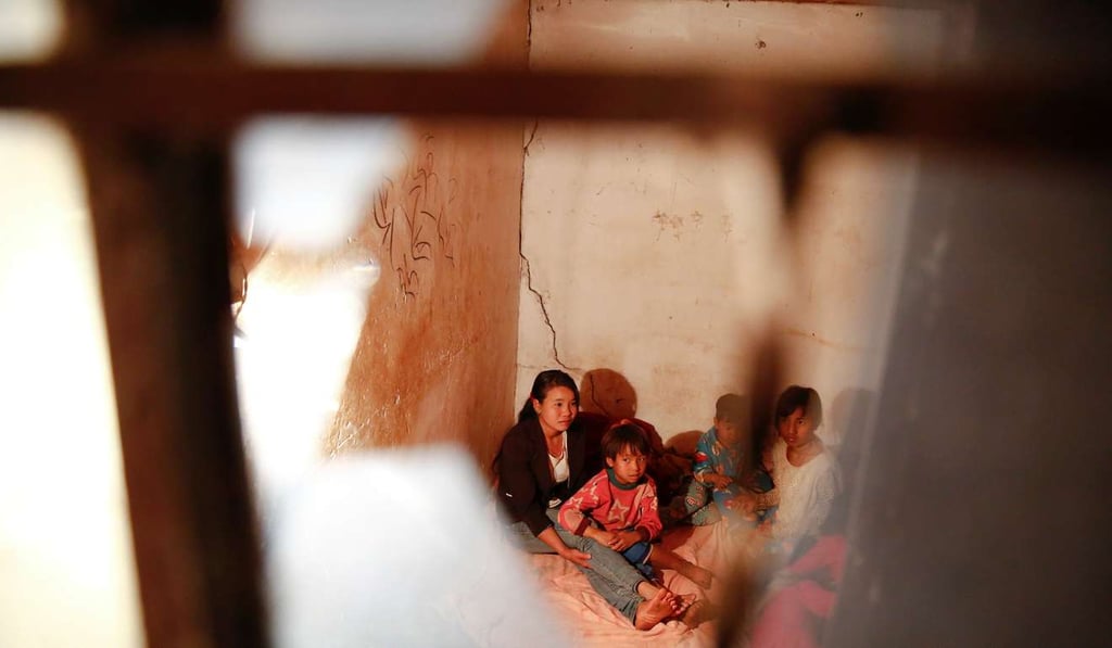 Refugees who fled fighting in neighbouring Myanmar find shelter in the house of a relative in the village of Baiyan near Nansan. Photo: Reuters