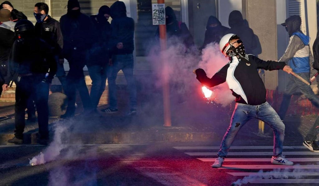 Protesters clash with police during a protest against the visit of Northern League leader Matteo Salvini in Naples on Saturday. Photo: EPA
