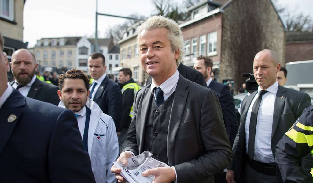Geert Wilders carries election leaflets while campaigning in Valkenburg, Netherlands, on Saturday. Photo: Bloomberg Geert Wilders carries election leaflets while campaigning in Valkenburg, Netherlands, on Saturday. Photo: Bloomberg