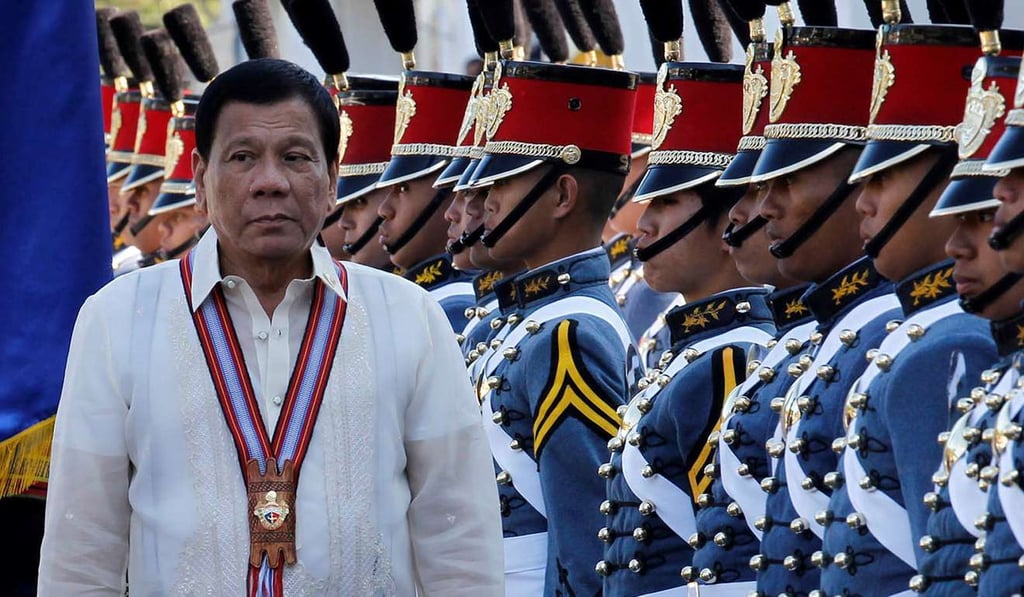 Philippine President Rodrigo Duterte walks past cadets to attend graduation ceremonies at the Philippine Military Academy in Baguio city. Photo: Reuters