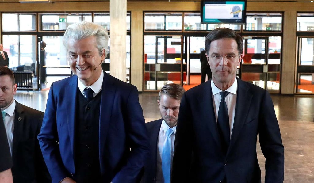 Dutch far-right politician Geert Wilders (left) and Prime Minister Mark Rutte arrive for their debate in Rotterdam, Netherlands, on Monday. Photo: Reuters