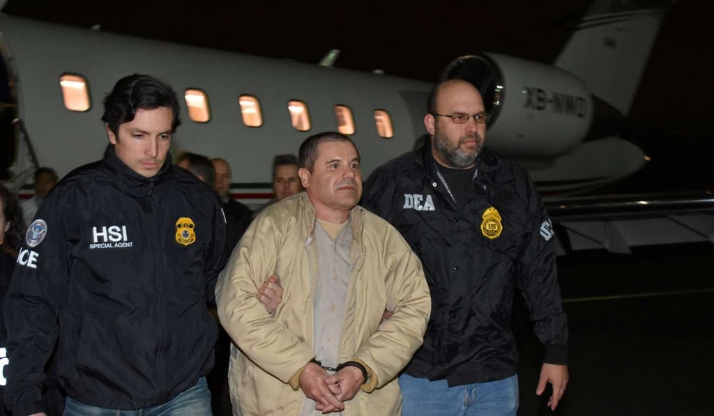 Mexico's top drug lord Joaquin Guzman is escorted as he arrives at Long Island MacArthur airport in New York on January 19. Photo: Reuters