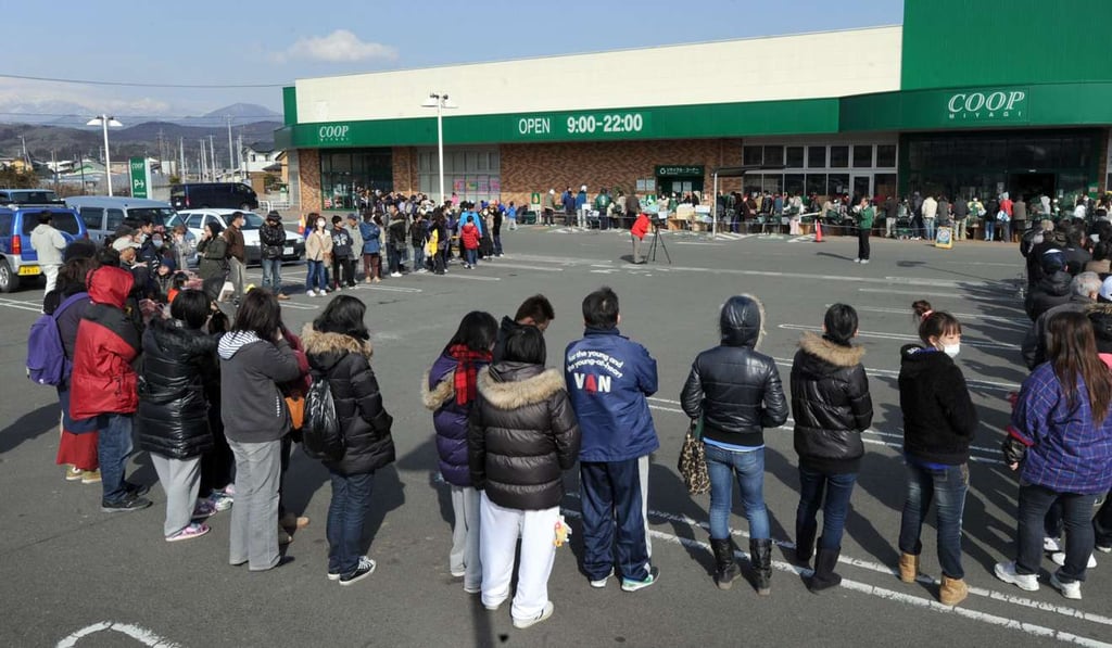 People queue for supplies before they run out at a supermarket in Fukushima, two days after a massive earthquake and tsunami hit the region in 2011. File photo: AFP