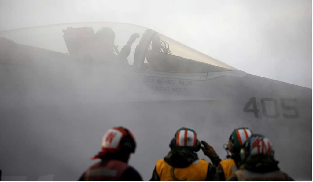 A US fighter jet prepares for take off from the deck of the USS Carl Vinson. Photo: Reuters