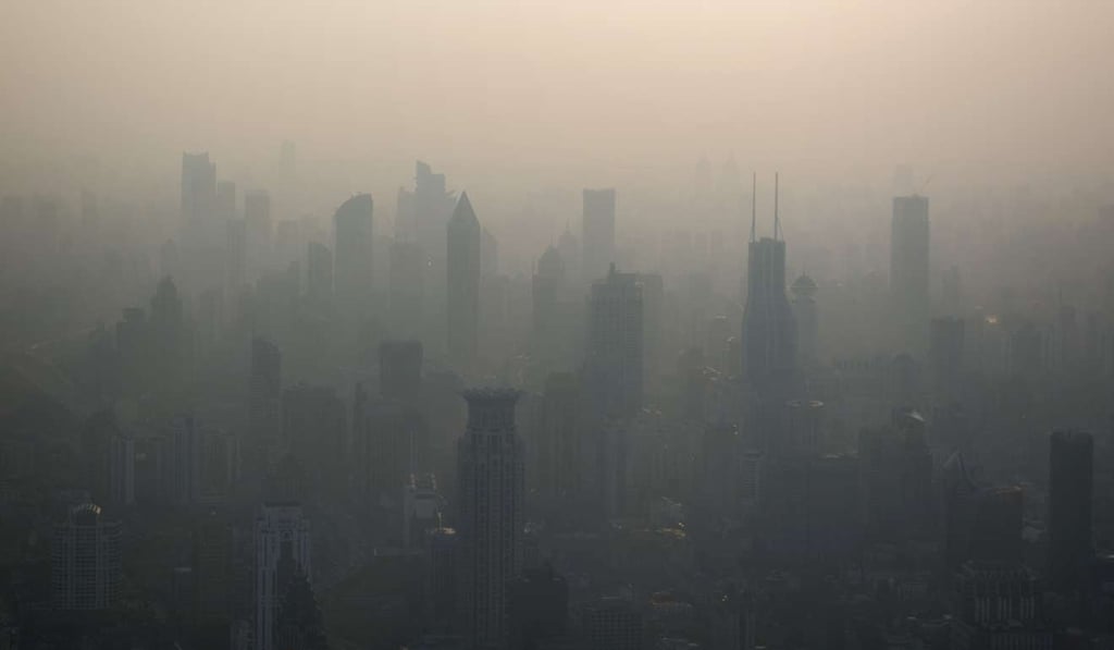 The skyline of Shanghai is barely perceptible on a polluted March day last year. Photo: AFP