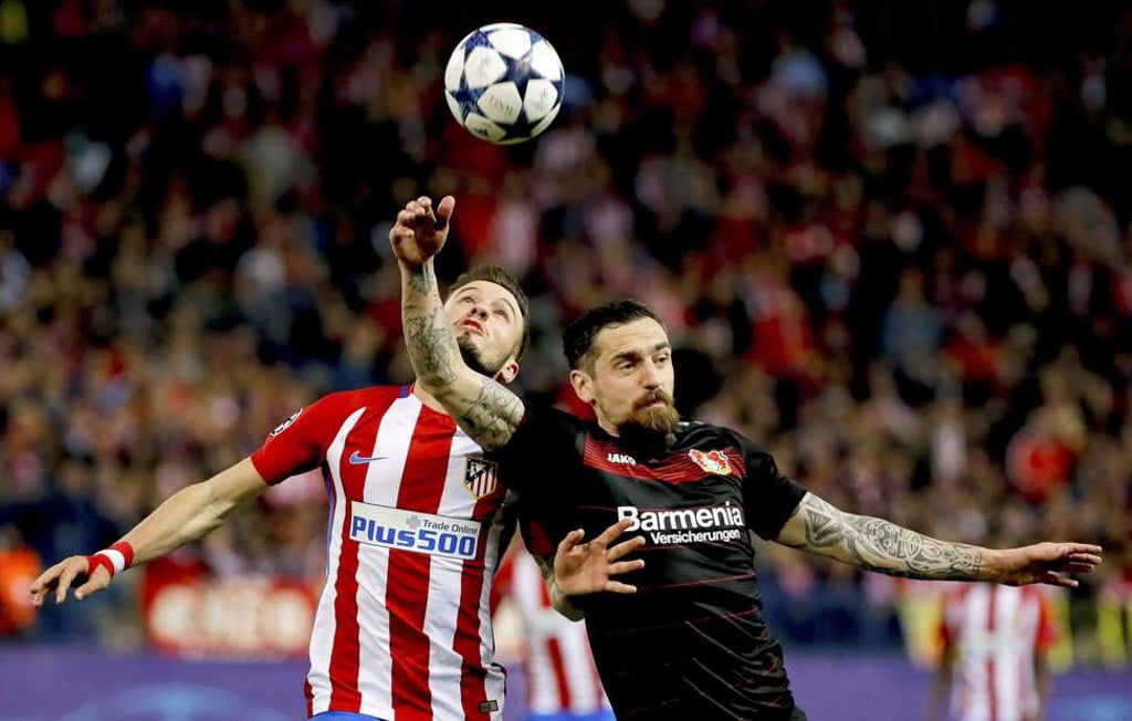 Atletico Madrid midfielder Saul Niguez in action against Leverkusen defender Roberto Hilbert. Photo: EPA Atletico Madrid midfielder Saul Niguez in action against Leverkusen defender Roberto Hilbert. Photo: EPA
