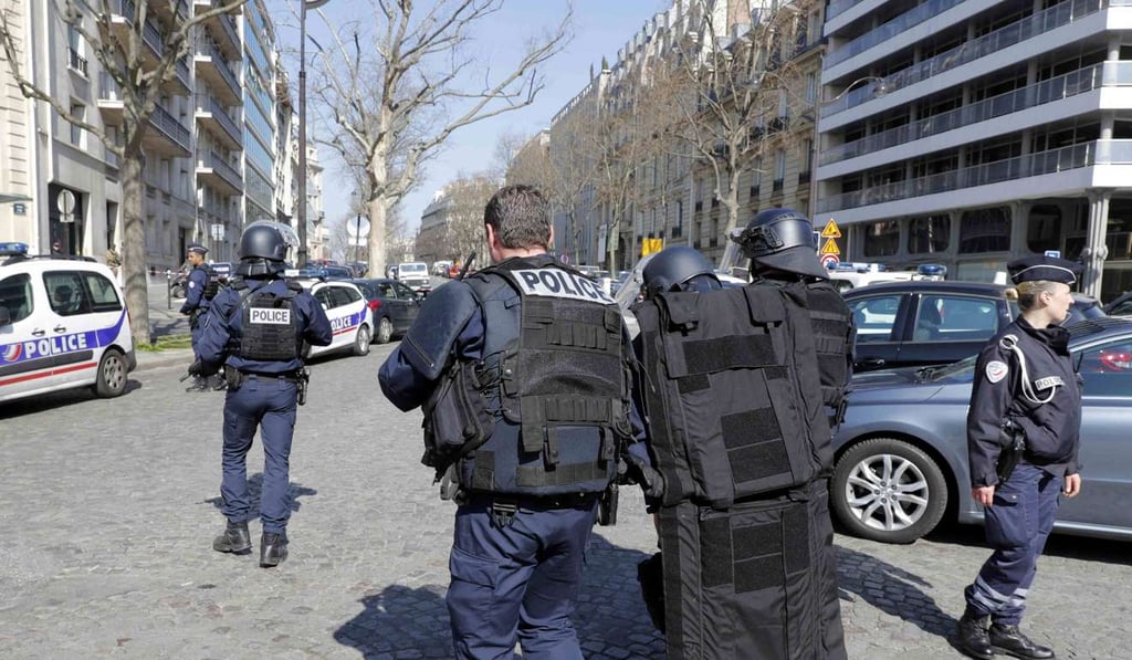 Police outside the International Monetary Fund (IMF) offices. Photo: Reuters