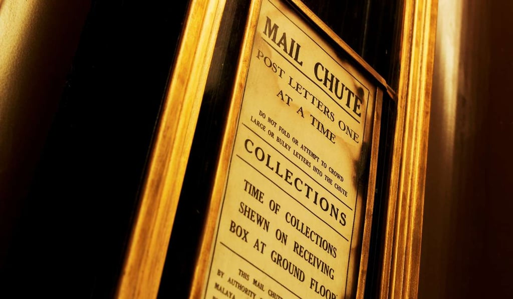 The vintage mail chute at Ascott Raffles Place.