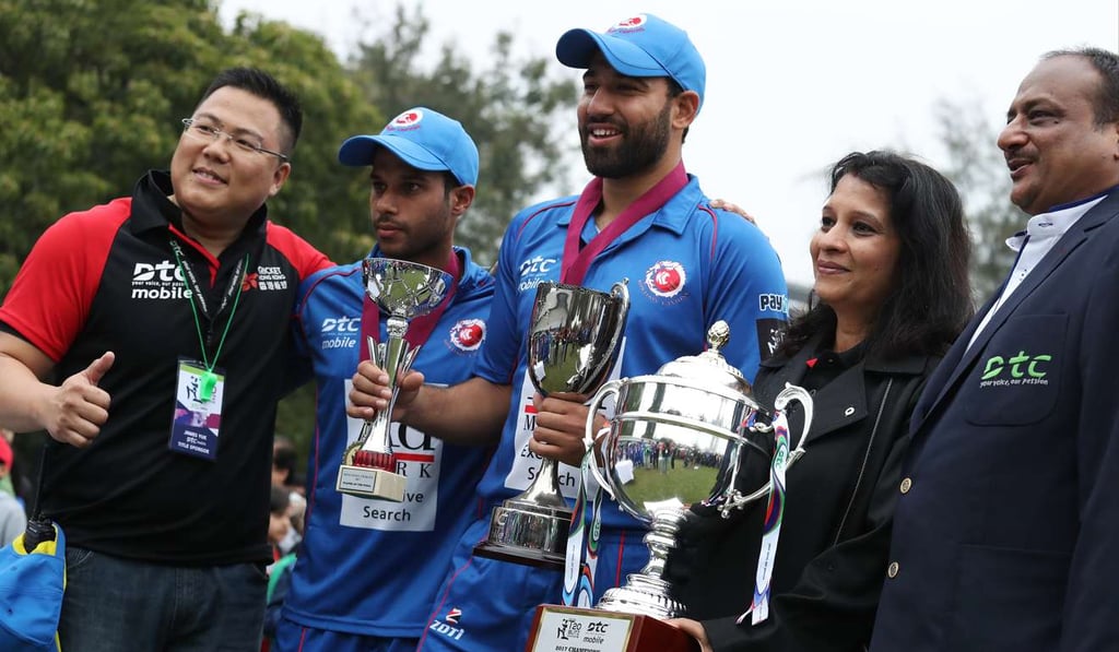 Kowloon Cantons captain Babar Hayat (centre) and team members celebrate after winning the T20 Blitz. Photo: Nora Tam / SCMP