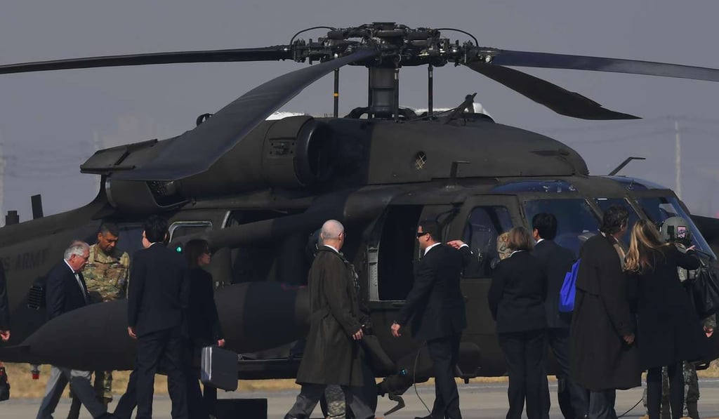 US Secretary of State Rex Tillerson, left, gets in a UH-60 Blackhawk after arriving at US Osan Air Base in Pyeongtaeck, South Korea. Photo: AFP