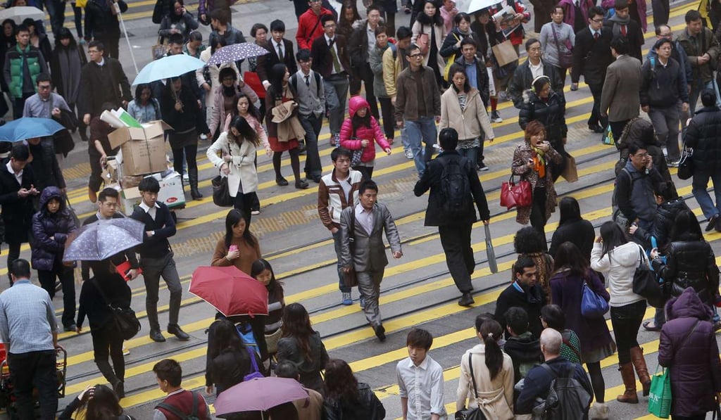 Crowds on Hennessy Road in Causeway Bay. Suzuki thinks the world has too many people. Photo: Sam Tsang