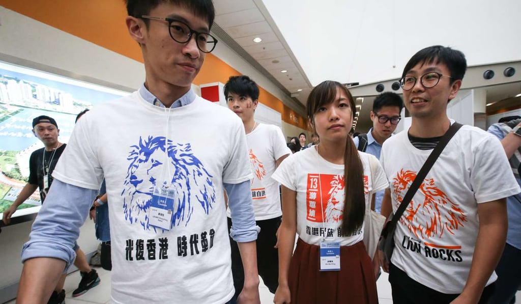 Sixtus Baggio Leung Chung-hang (left) and Yau Wai-ching (centre) of Youngspiration, seen here on the night of the election on September 5 last year, were two of several localist candidates who got elected to the Legislative Council. Leung and Yau have since lost their seats for having taken their oaths improperly. Photo: Felix Wong