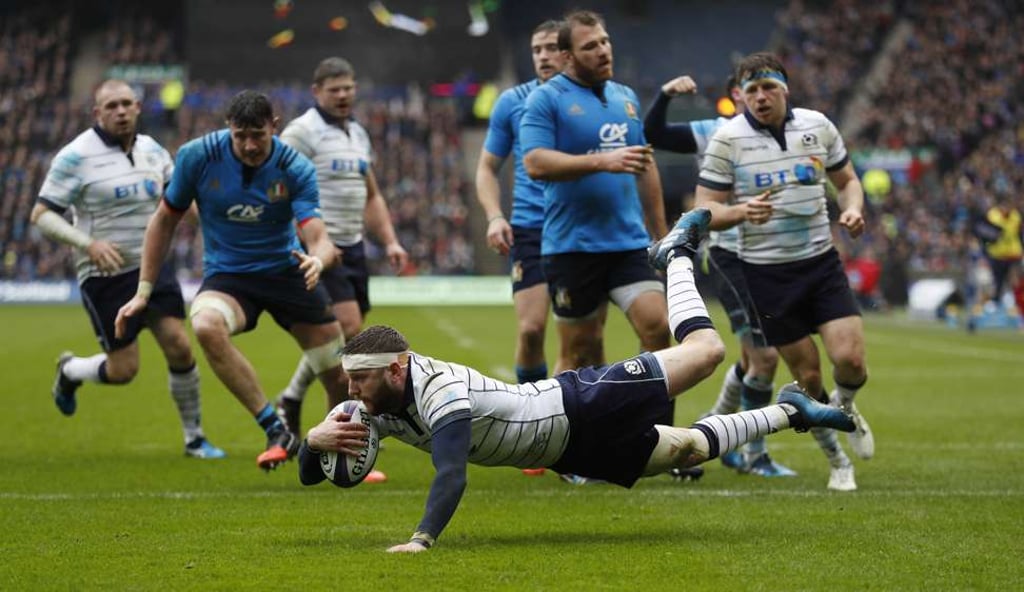 Scotland's Finn Russell scores his team’s first try against Italy. Photo: Reuters