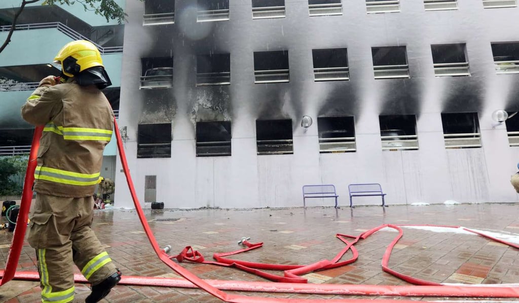 Flames and smoke billowed out of the second floor of the car park complex. Photo: Felix Wong