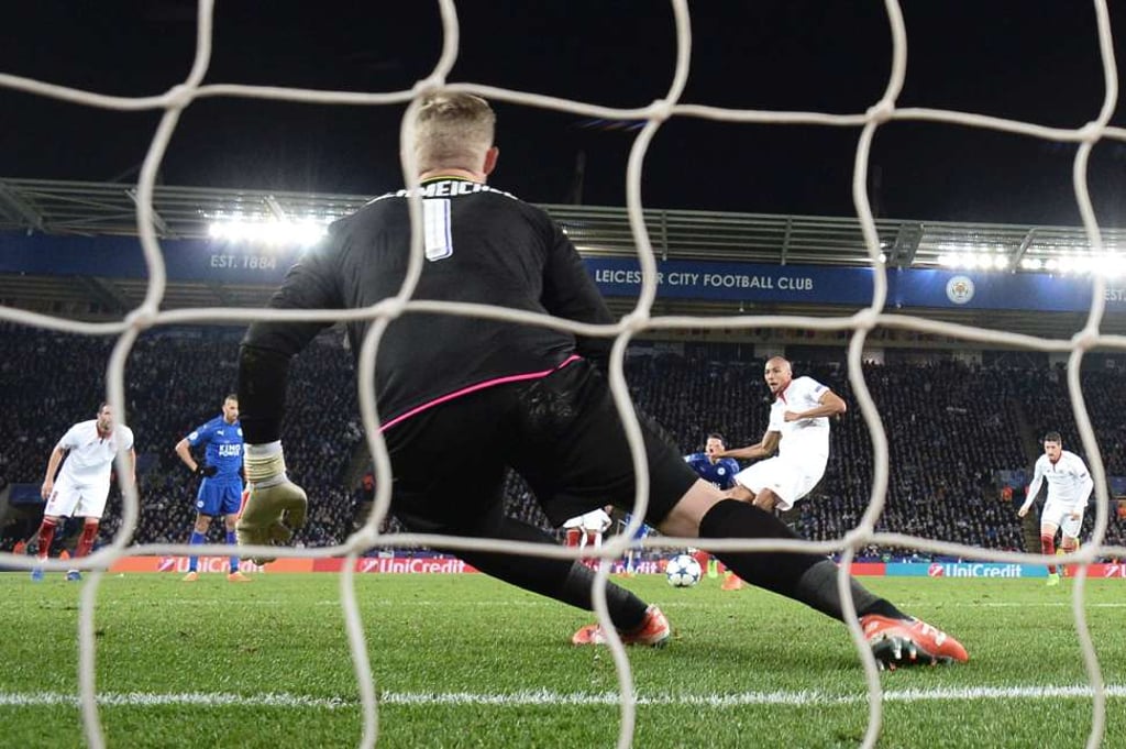 Schmeichel dives to save a penalty in the Champions League win over Sevilla. Photo: AFP Schmeichel dives to save a penalty in the Champions League win over Sevilla. Photo: AFP