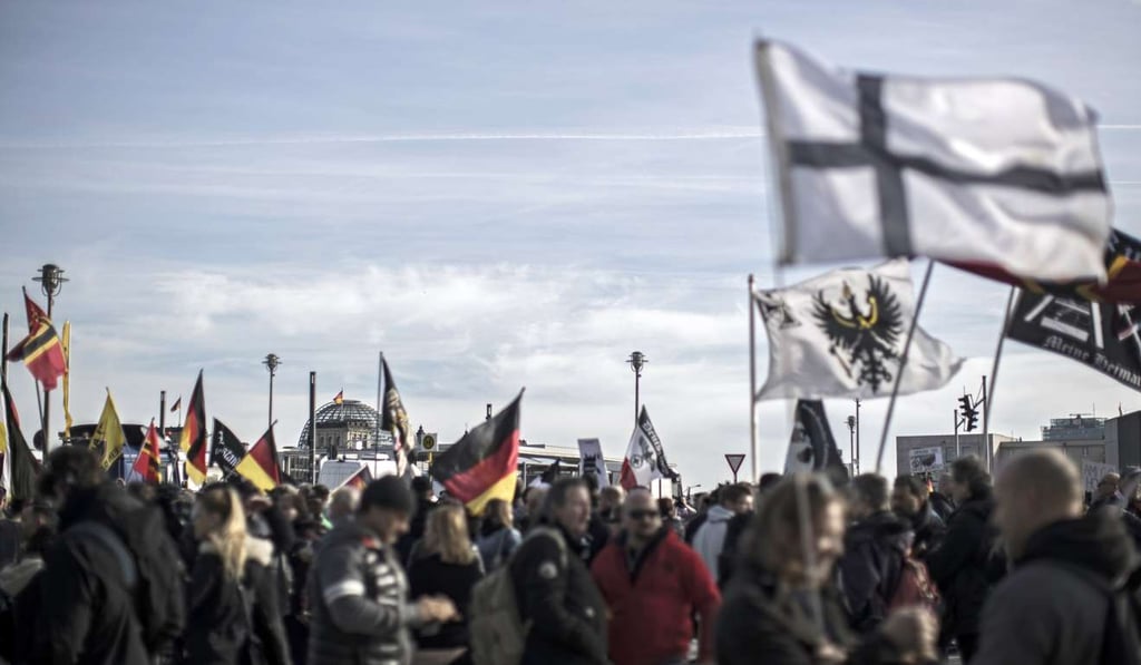 The roof of the German Parliament (Reichstag) is seen amid flags during a far-right demonstration in Berlin this month. According to the latest opinion polls, in none of the upcoming elections in Europe do populist parties have a realistic power option. Photo: EPA