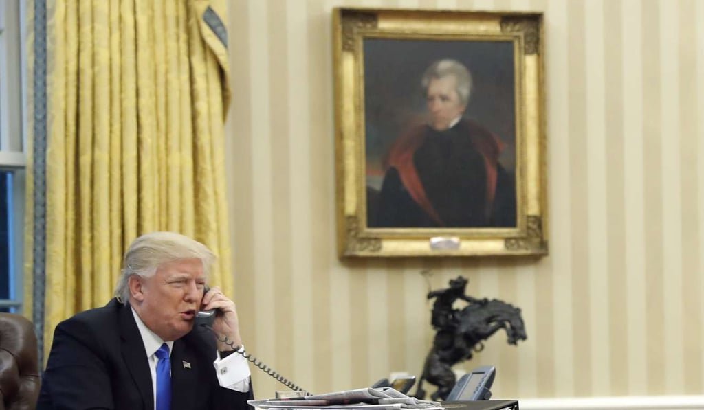 US President Donald Trump speaks on the phone with the Prime Minister of Australia Malcolm Turnbull from the Oval Office of the White House in January. Photo: AP
