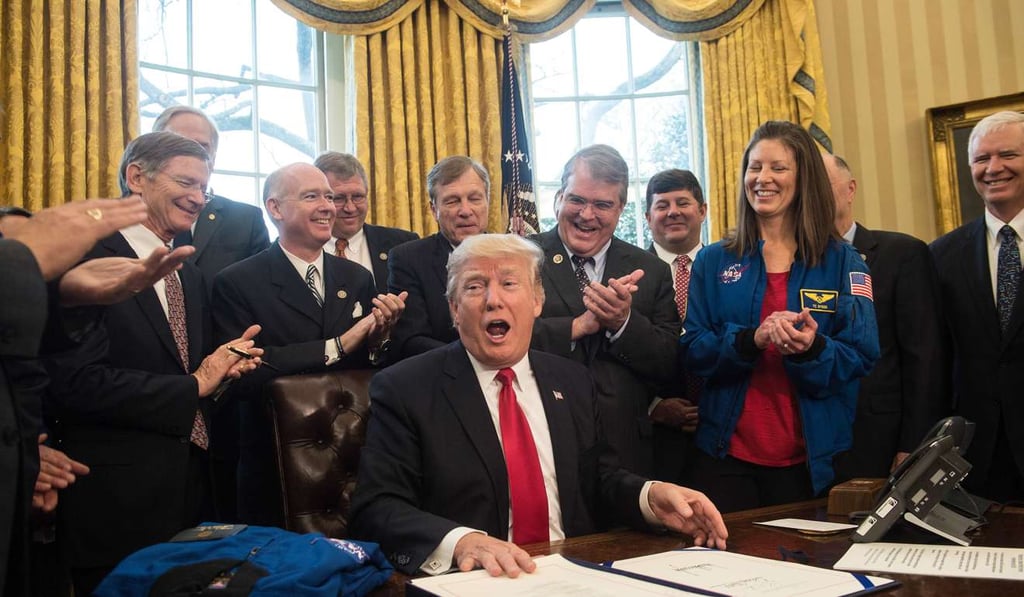 US President Donald Trump reacts after signing a bill increasing funding for NASA in the Oval Office at the White House in Washington, DC, on March 21, 2017. Photo: AFP US President Donald Trump reacts after signing a bill increasing funding for NASA in the Oval Office at the White House in Washington, DC, on March 21, 2017. Photo: AFP