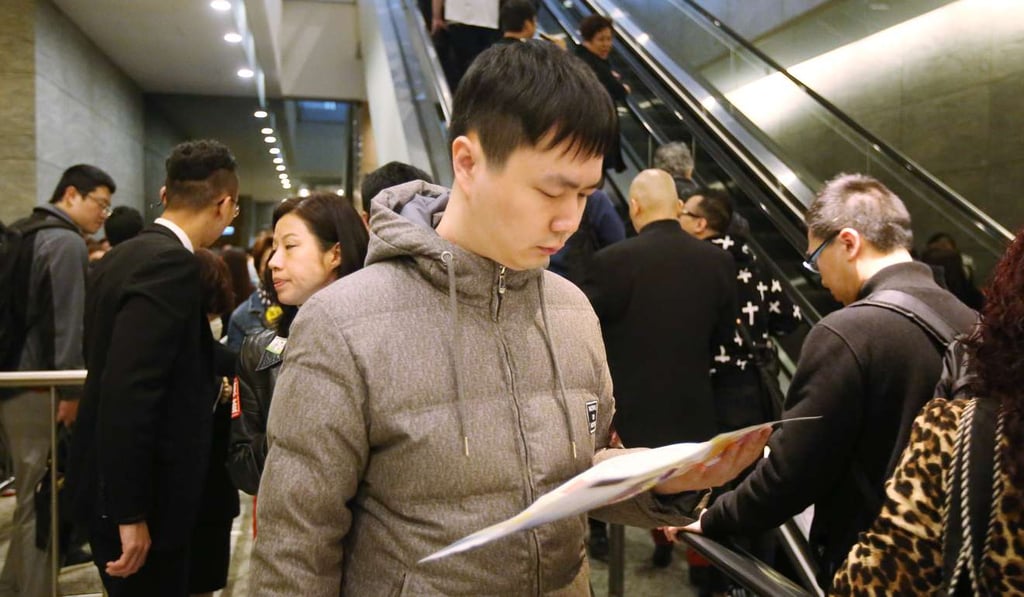A potential buyer at the sales office of Cullinan West at International Commerce Centre in Tsim Sha Tsui. Photo: Edward Wong