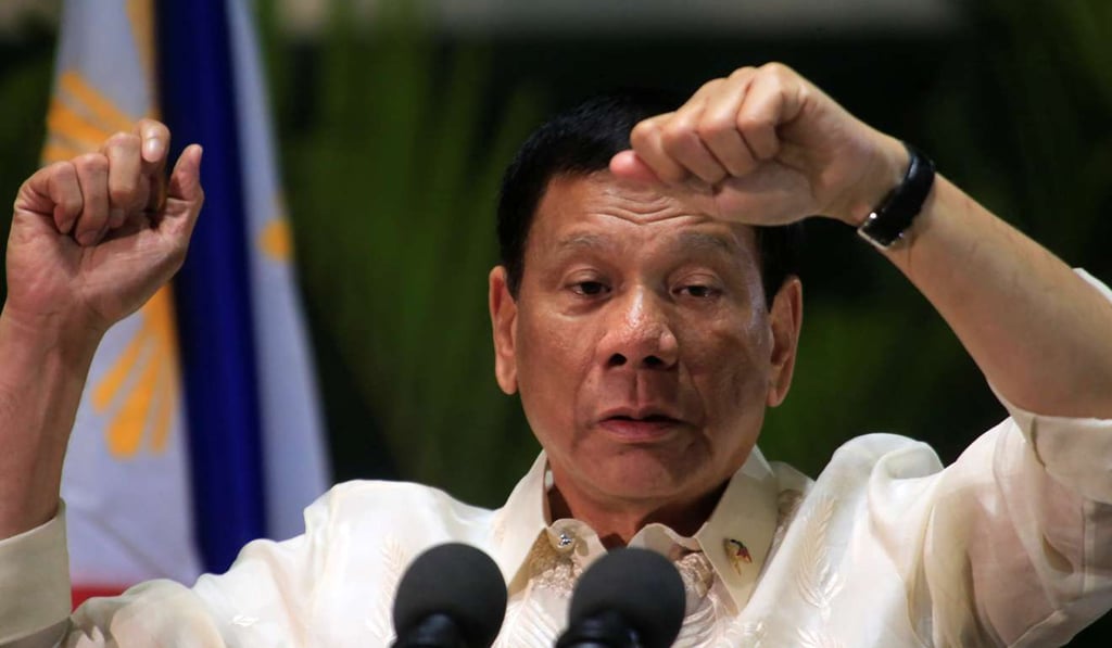 Philippine President Rodrigo Duterte gestures while answering questions during a news conference upon arrival from a trip to Myanmar and Thailand in Manila. Photo: Reuters