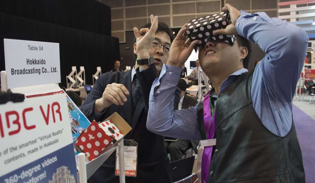 A man watches VR amusement products at the Hong Kong International Film and TV Market in Hong Kong this month. The trade event featured over 800 exhibitors from 35 countries and regions. Photo: Xinhua A man watches VR amusement products at the Hong Kong International Film and TV Market in Hong Kong this month. The trade event featured over 800 exhibitors from 35 countries and regions. Photo: Xinhua