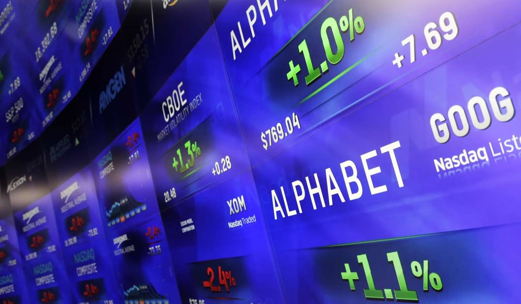 The electronic screens post prices of Alphabet stock, the mother firm of Google. Photo: AP The electronic screens post prices of Alphabet stock, the mother firm of Google. Photo: AP