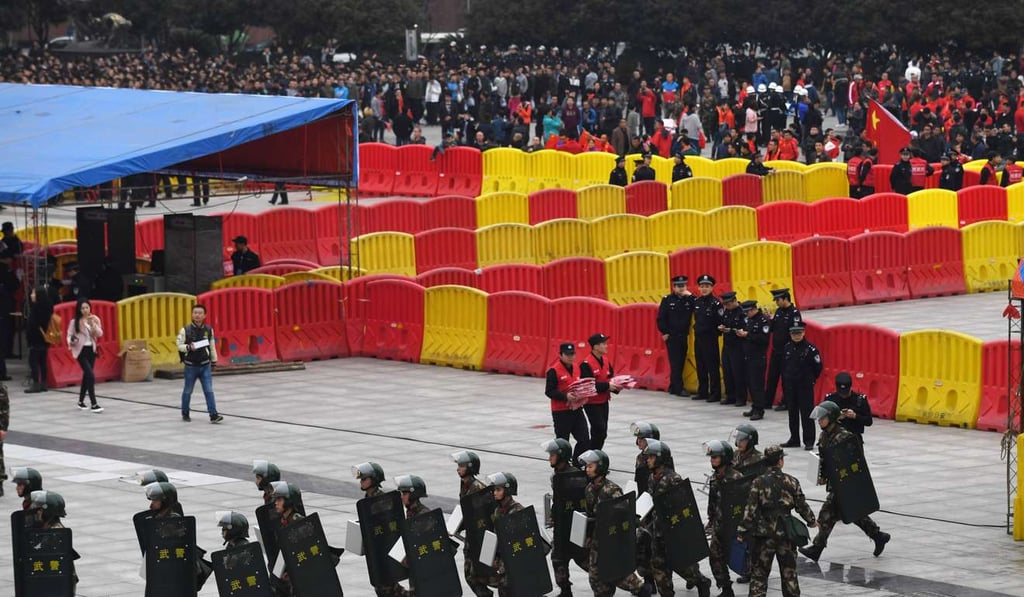 Security before the game at He Long Stadium. Photo: AFP Security before the game at He Long Stadium. Photo: AFP