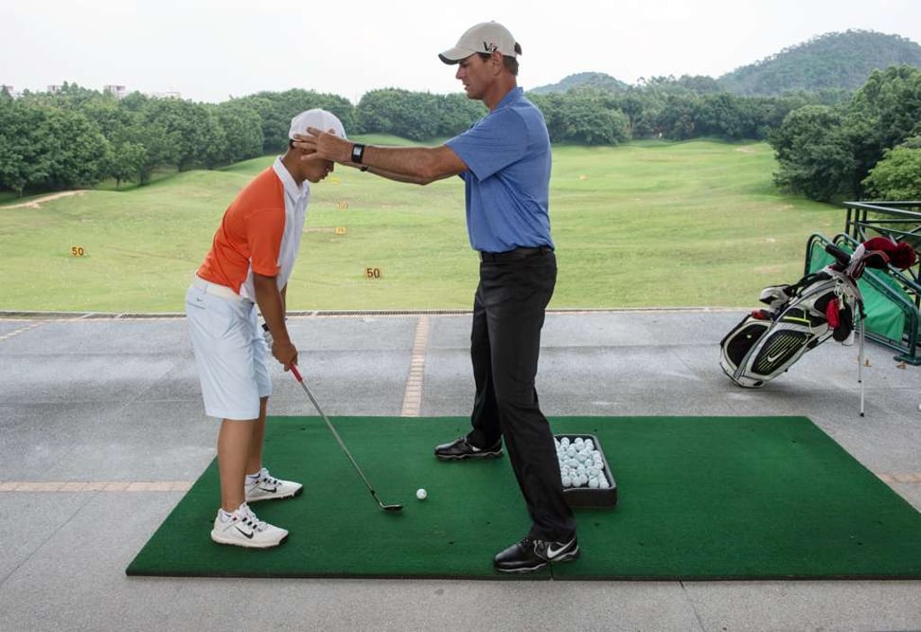 A coaching lesson on the range Hillview Golf Club in Dongguan but persistent bad weather and fierce competition hit golf and hotel revenues at the site, owned by HNA Holding Group, Photo: Richard Castka/Sportpixgolf.com