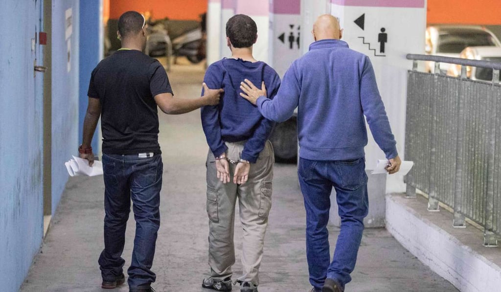 Am American-Israeli teenager is escorted by guards as he leaves the Israeli Justice court in Rishon Lezion on Thursday. Photo: AFP