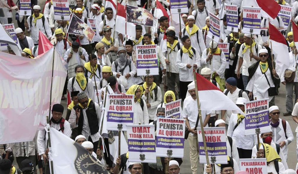 Indonesian Muslims march during a rally against Jakarta's minority Christian Governor Basuki Tjahaja Purnama, who is being prosecuted for blasphemy. Photo: AP