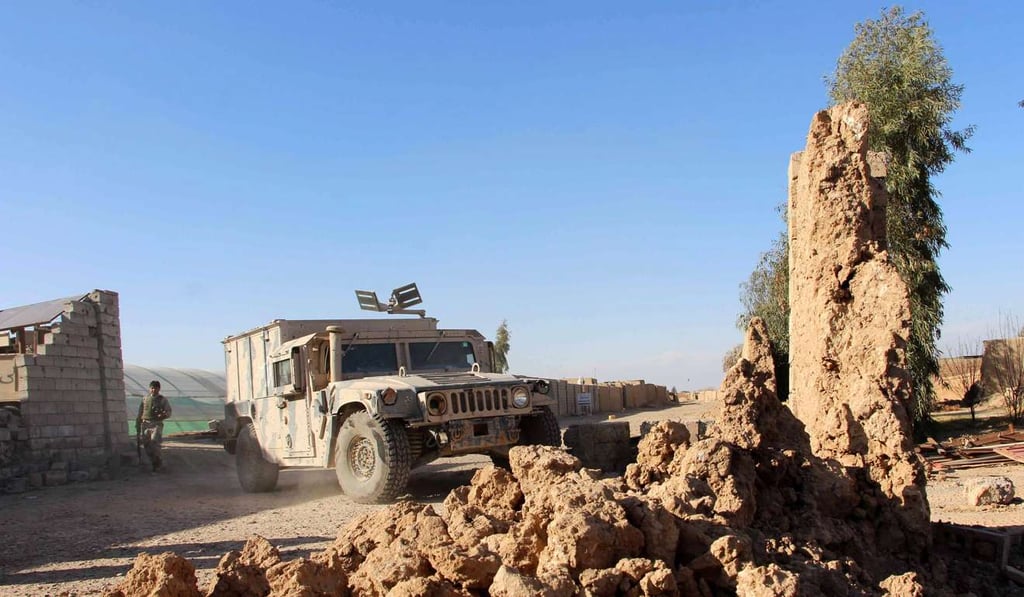 Afghan security officials secure an area during an operation against Taliban militants in Helmand province, Afghanistan. Photo: EPA Afghan security officials secure an area during an operation against Taliban militants in Helmand province, Afghanistan. Photo: EPA