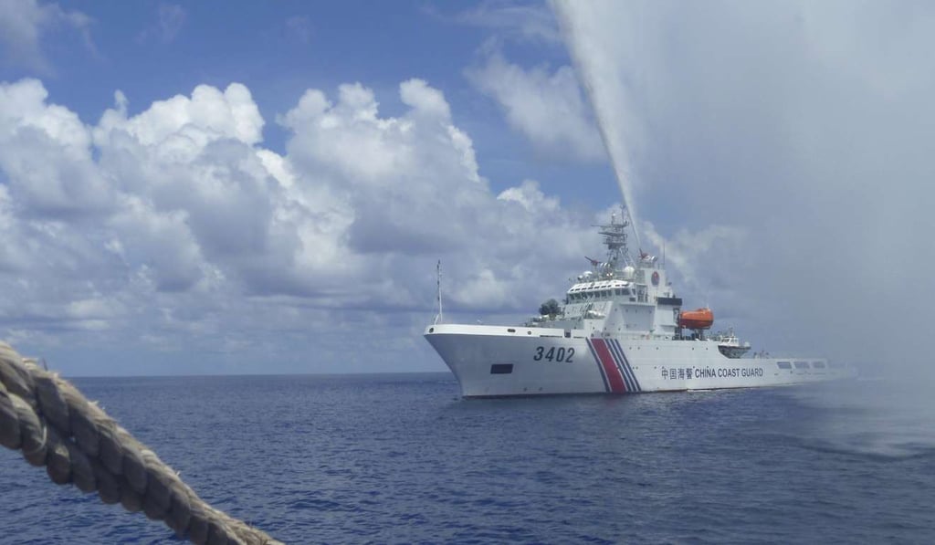 A file photo from September, 2015 showing a Chinese Coast Guard ship warning off Filipino fishermen in the disputed Scarborough Shoal. Photo: AP