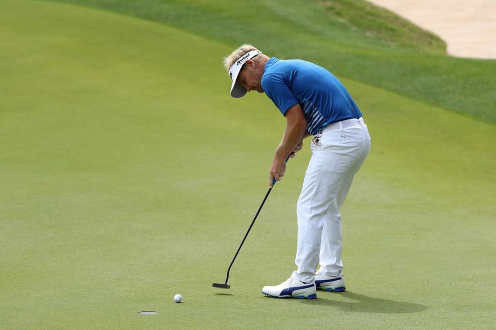 Kjeldsen putts for the win on the 17th hole against world number two McIlroy. Photo: AFP Kjeldsen putts for the win on the 17th hole against world number two McIlroy. Photo: AFP