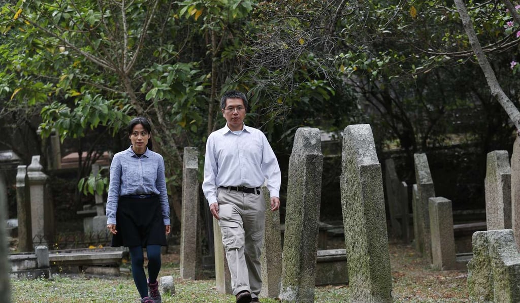 Carmen Kam and Eric Wong walk around the cemetery in Happy Valley. Photo: Nora Tam