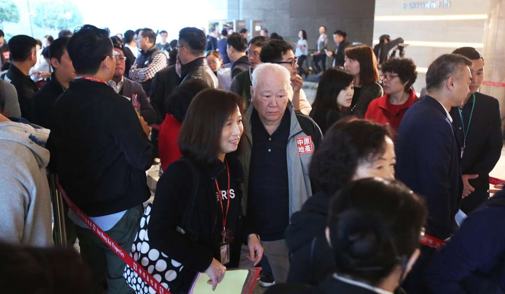 Potential buyers at the Cullinan West sales office. Home buyers seem unfazed by the recent interest rate rise. Photo: Edward Wong