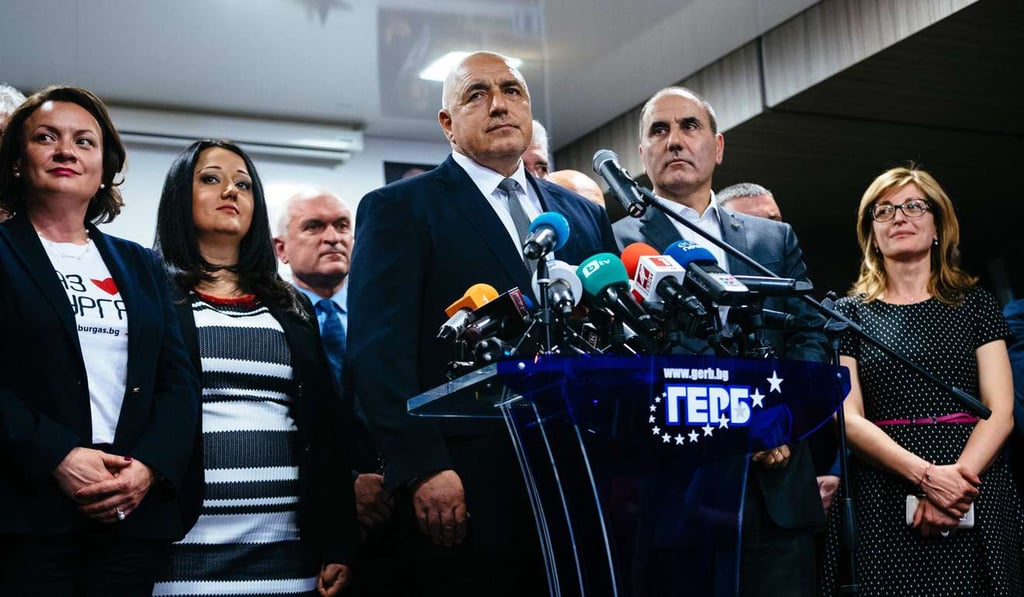 Head of the centre-right GERB party and former prime minister Boyko Borisov (centre) speaks to media in Sofia on Sunday, after his party won the country's parliamentary election. Photo: AFP