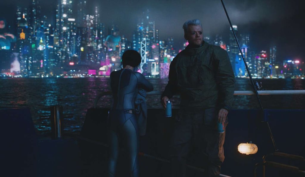 Scarlett Johansson (Major) and Pilou Asbaek (Batou) in a scene from Ghost in the Shell, with Victoria Harbour providing a glittering backdrop. Photo: Paramount Pictures/Dreamworks Scarlett Johansson (Major) and Pilou Asbaek (Batou) in a scene from Ghost in the Shell, with Victoria Harbour providing a glittering backdrop. Photo: Paramount Pictures/Dreamworks