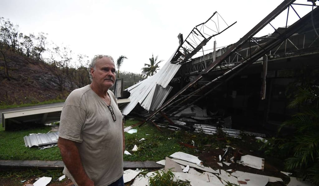 Dave Mcinnerney inspects the ruins of his motel at Shute Harbour in northern Australia on Wednesday after it was destroyed by Cyclone Debbie. Photo: EPA