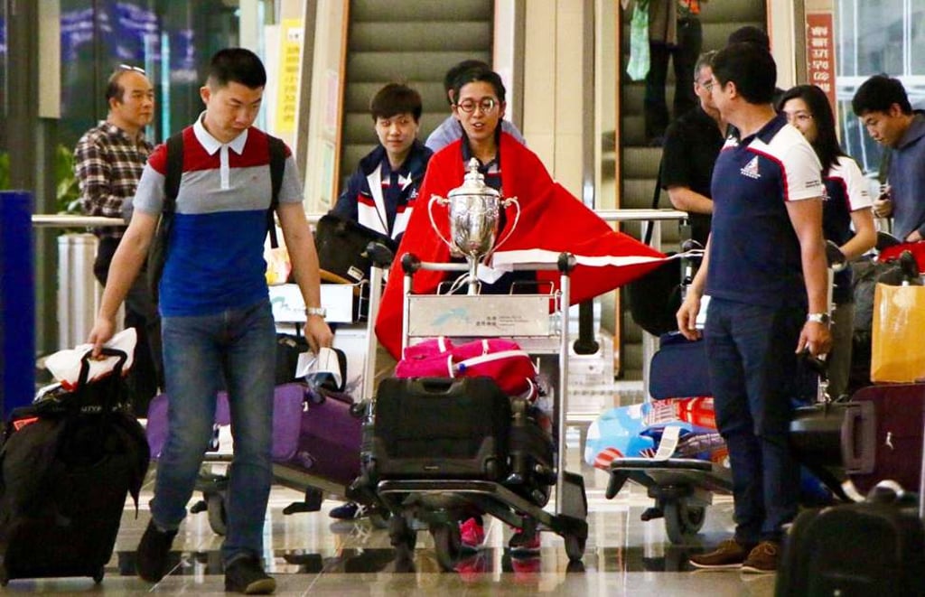 Ng On-yee arriving at Hong Kong International Airport with the World Championship trophy. Photo: Handout