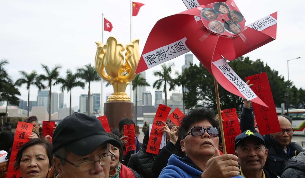 Protesters from a grass-roots housing rights group rally at the Golden Bauhinia Square in Wan Chai, on February 26, a month before the 2017 chief executive election. Their demands included the reintroduction of tenancy controls and faster development of public housing. Photo: Sam Tsang