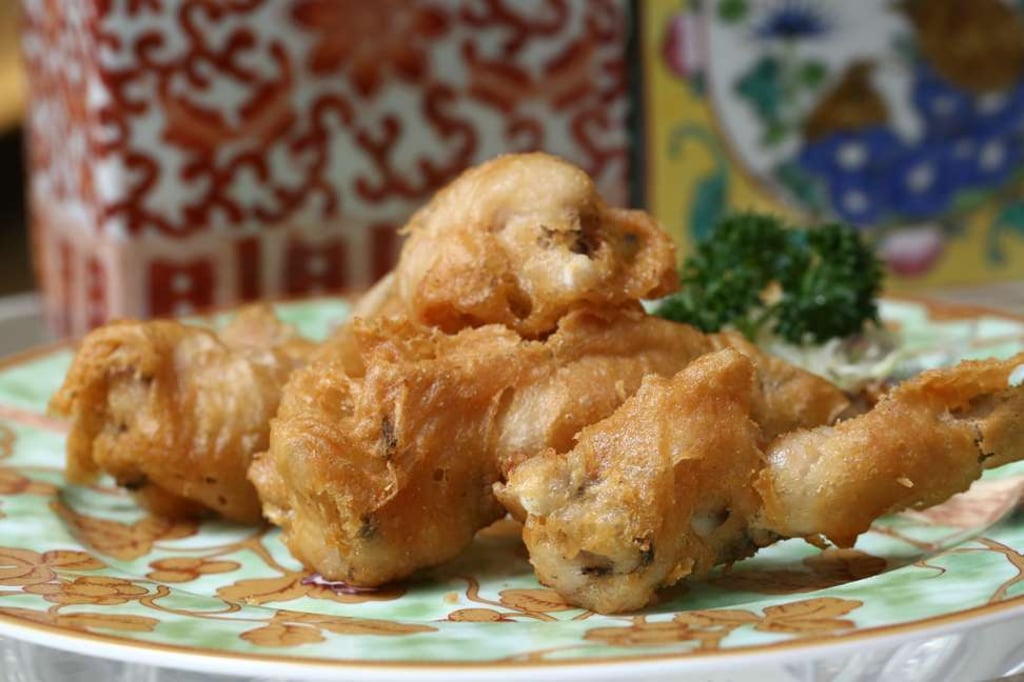 Crispy frog legs with spicy salt. Photo: Jonathan Wong